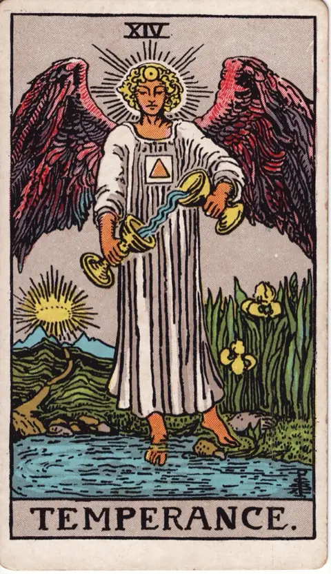 Temperance, from the 1909 Rider-Waite-Smith deck: a winged angel in white stands with one foot on land and one in a pool, pouring water between two cups, a path leading to a crown of light over distant mountains.