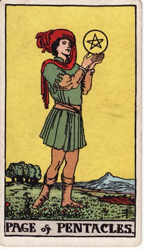 Page of Pentacles, from the 1909 Rider-Waite-Smith deck: a young man stands in a field of flowers holding a pentacle up in both hands and studying it, ploughed land and trees behind.