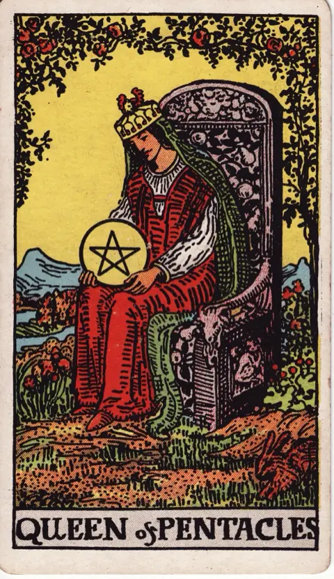 Queen of Pentacles, from the 1909 Rider-Waite-Smith deck: a queen sits on a throne carved with goats and fruit in a garden, a pentacle in her lap, roses overhead and a rabbit at her feet.