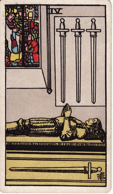 Four of Swords, from the 1909 Rider-Waite-Smith deck: a knight lies on a tomb with his hands joined in prayer, three swords hanging on the wall above him and one along the side of the tomb, a stained-glass window behind.