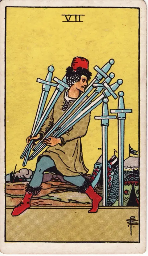 Seven of Swords, from the 1909 Rider-Waite-Smith deck: a man tiptoes away from a camp of tents carrying five swords, looking back over his shoulder at the two he has left standing.