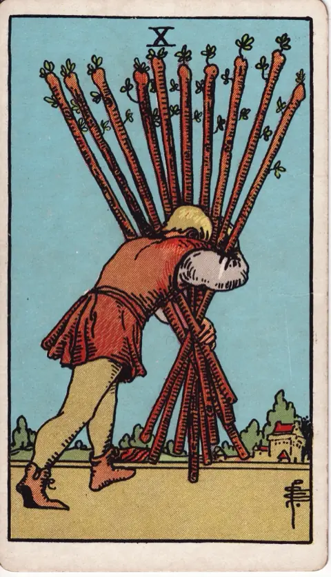 Ten of Wands, from the 1909 Rider-Waite-Smith deck: a man stoops under a heavy bundle of ten wands, carrying them toward a town in the distance.